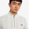 Poloshirts mit Reißverschluss am Kragen und Raglanärmeln